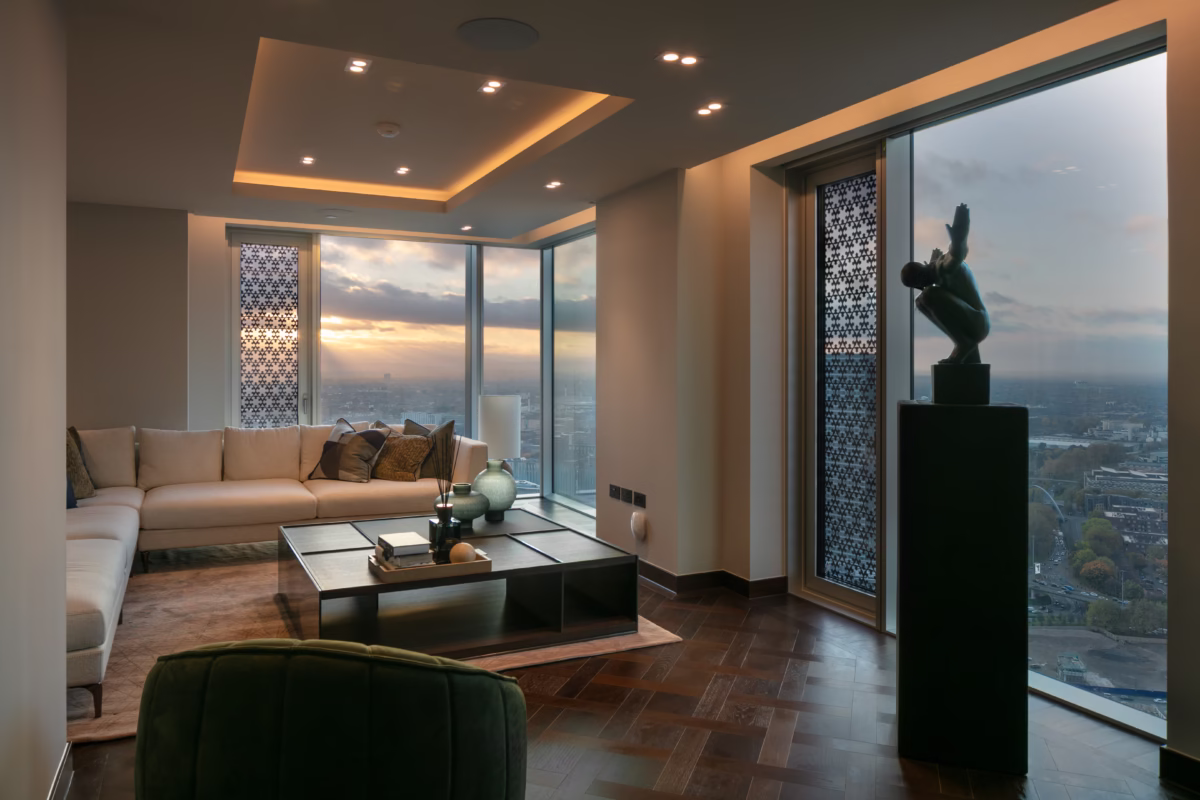 Luxury smart home penthouse interior with layered lighting, automated blinds and minimalist high-end living space at dusk.