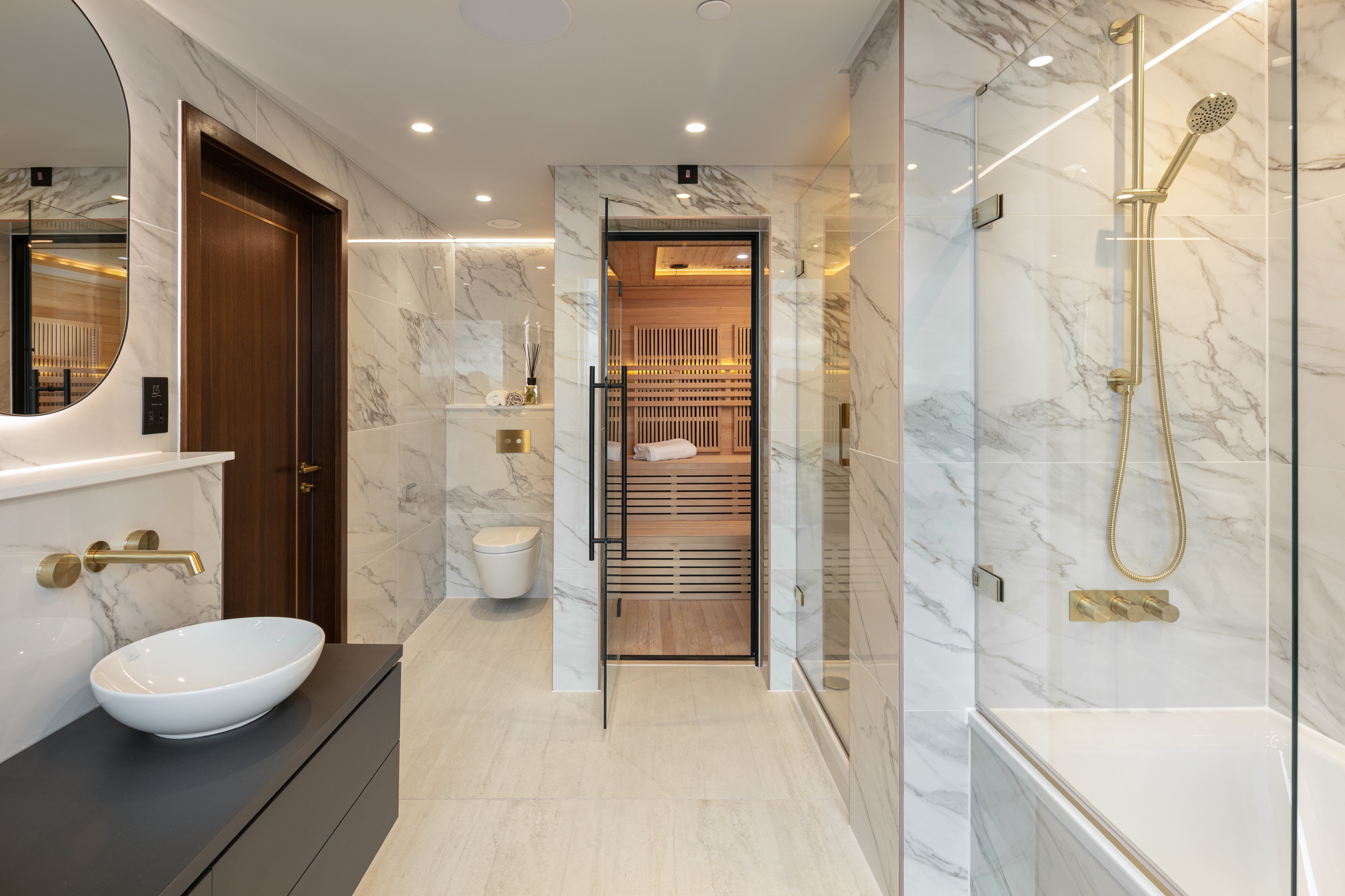 Luxury smart home bathroom and sauna detail with premium finishes, subtle lighting and integrated building services.