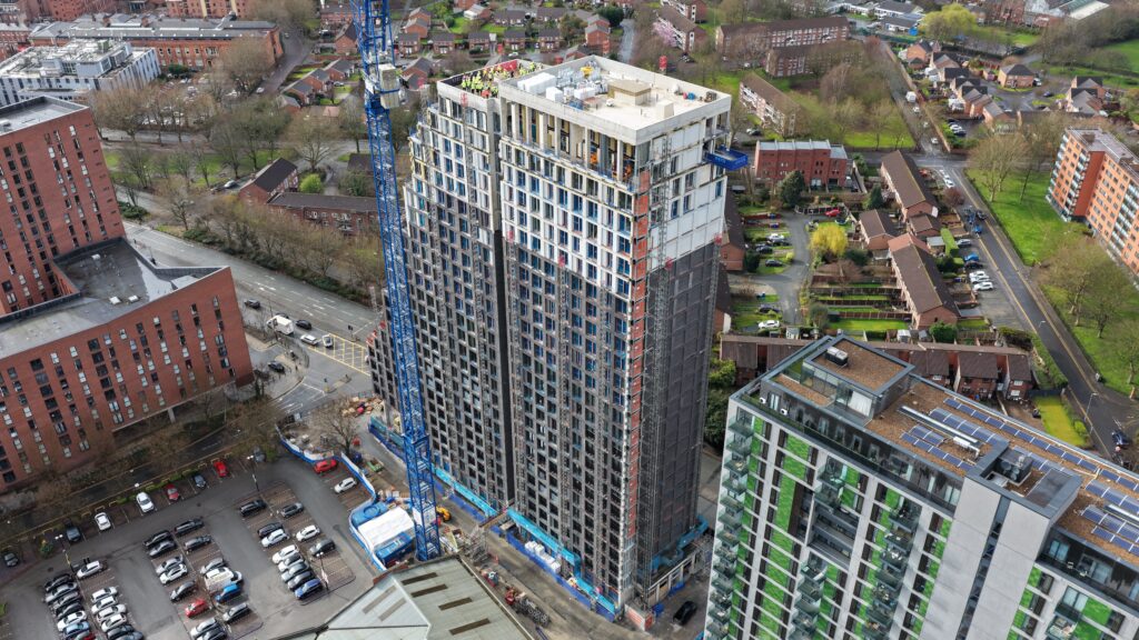 Aerial view of urban high-rise construction site.